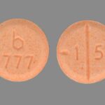Orange round Adderall 15mg tablet with imprint b 777 1 5 for clinical identification