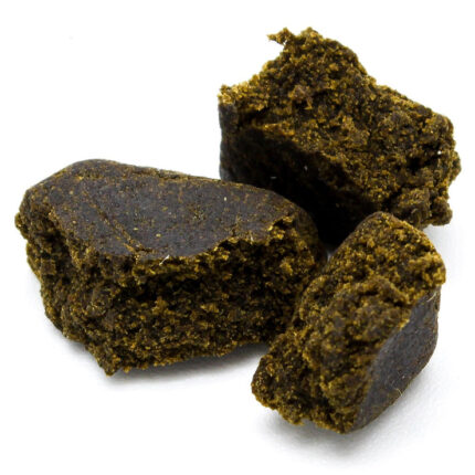 A block of authentic Afghan Black Pressed Hash showing its dark, oily exterior and soft, resinous interior.Buy Afghan Black Pressed Hash Online
