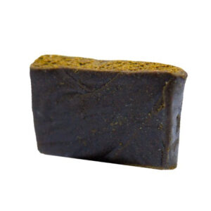 image of Sticky and pliable dark brown Sage N' Sour Hash by MTL Cannabis, ideal for rolling snake sticks.