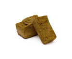 Buy Pressed Hash 2g Online Artisanal 2g Pressed Hash brick by Homestead, showcasing a rich, dark, and oily texture.