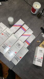 Laboratory storage of amber antitussive bottles.Makatussin 80ml vs Toseina 250ml comparison