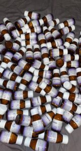 Authentic brown glass jar packaging for Farmapram 2mg bars.
